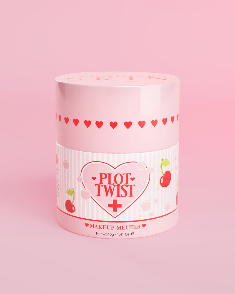 Ένα ροζ δοχείο P.Louise Plot Twist Makeup Melting Cleansing Balm με σχέδια καρδιά και κεράσι στην ετικέτα σε ροζ φόντο