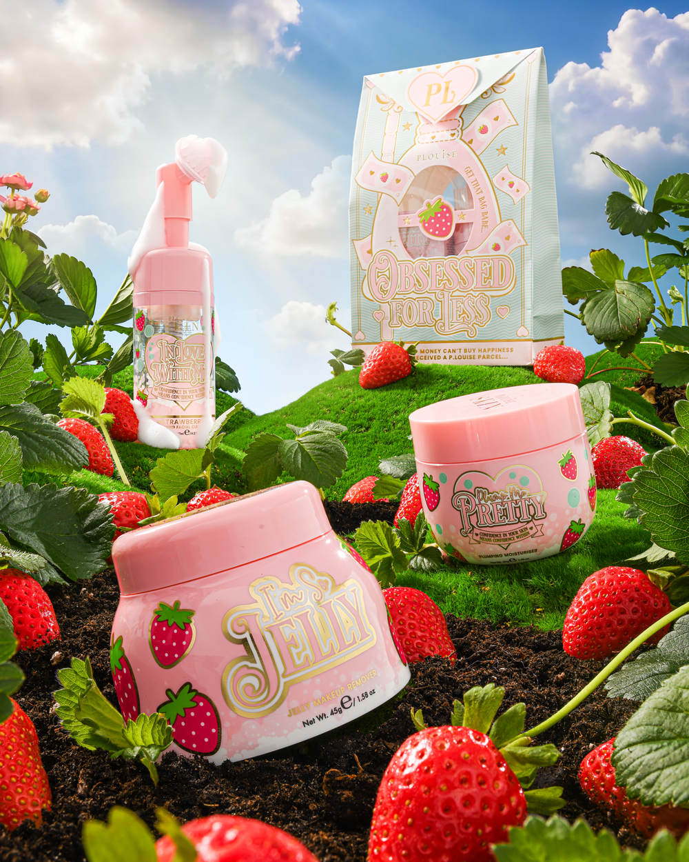 P.Louise Strawberry Obsessed For Less Double Cleanse & Moisturise Skincare Set σε έναν καταπράσινο λόφο που περιβάλλεται από φράουλες