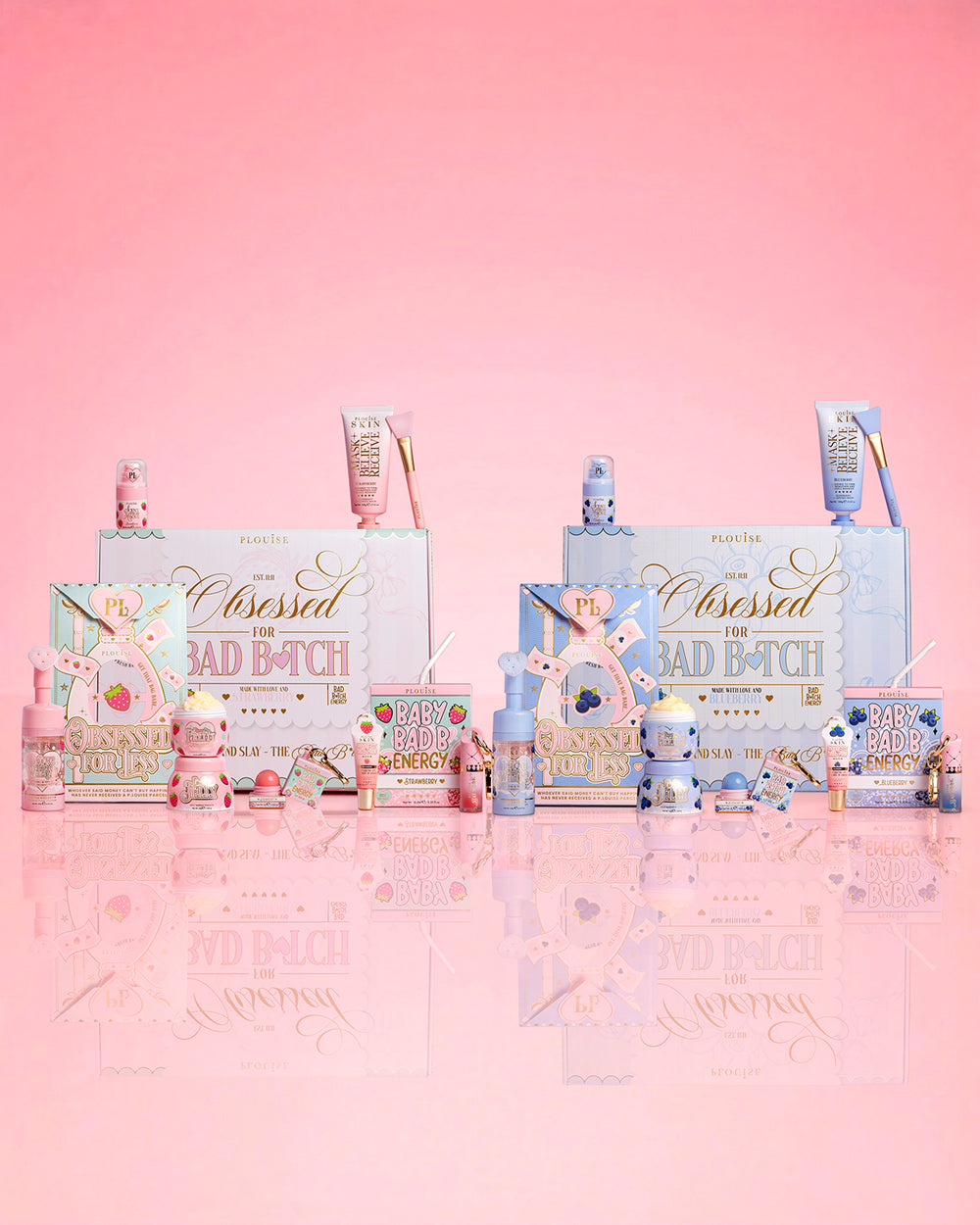Collection of P.Louise strawberry and blueberry beauty products with 'Obsessed For Bad Bitch' packaging on a pink background